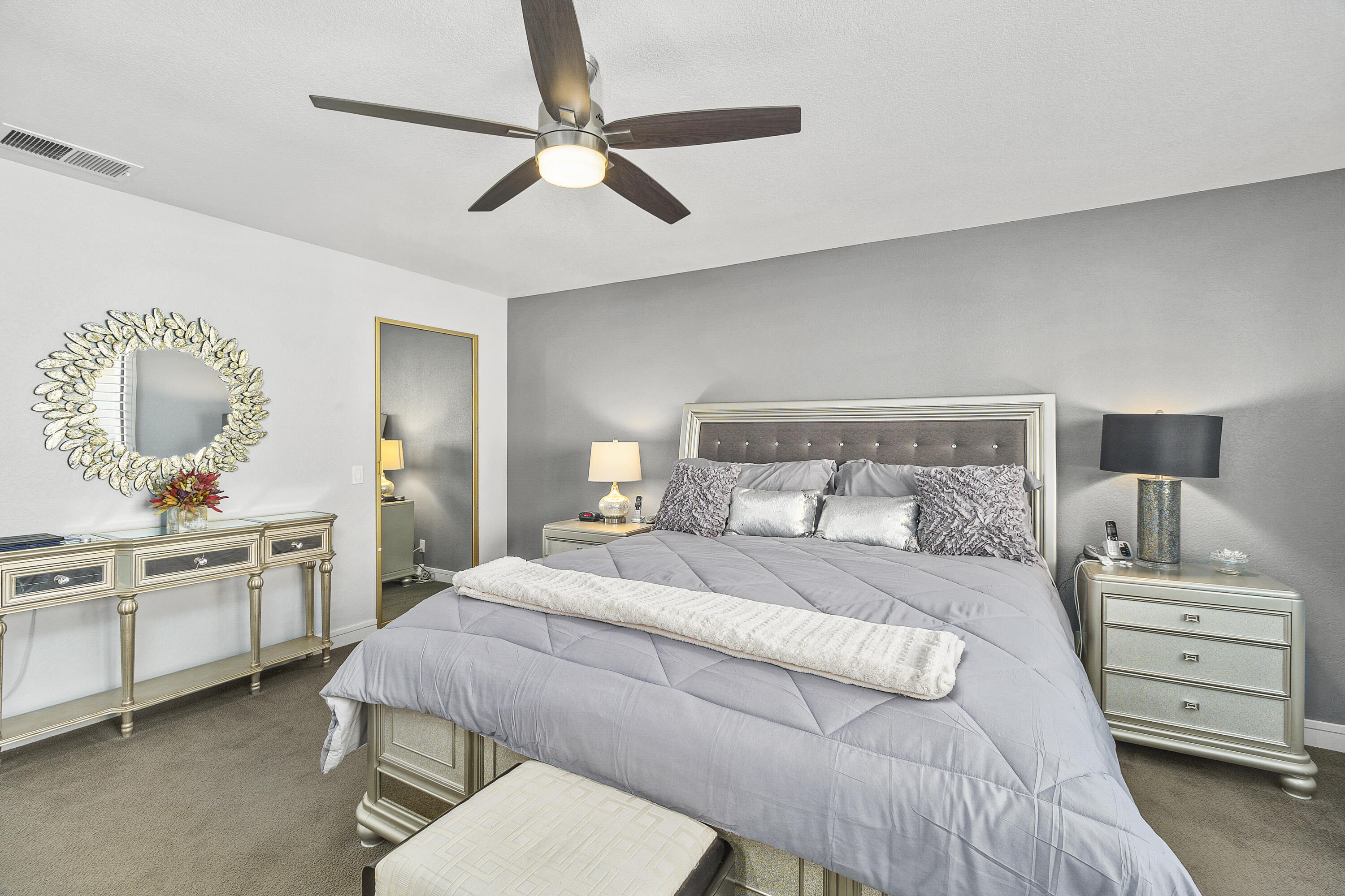 43 Conejo Circle Palm Desert, CA 92260 - Photo 19 of 58 a bedroom with a bed and a dresser