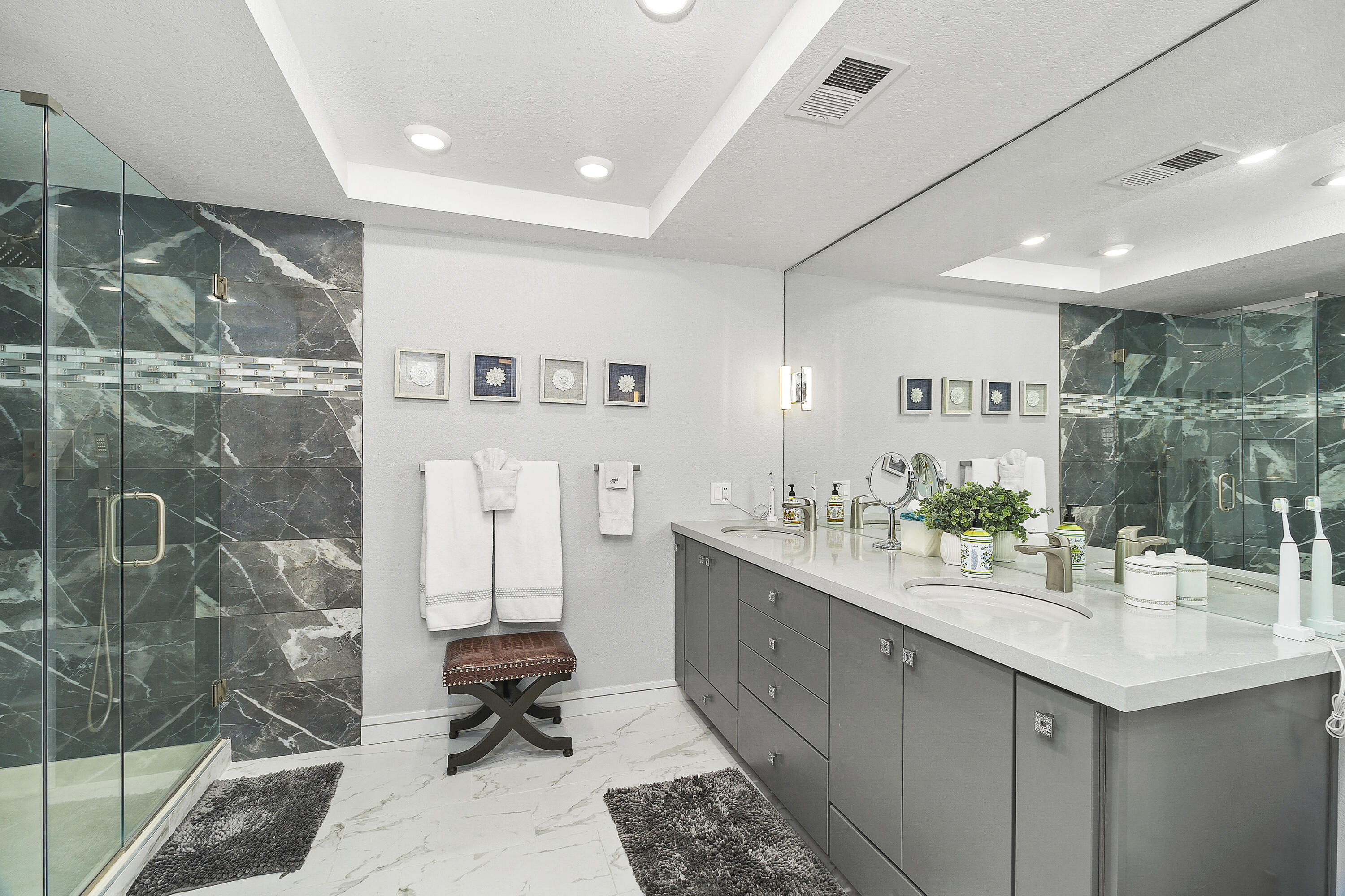 43 Conejo Circle Palm Desert, CA 92260 - Photo 21 of 58 a bathroom with a sink mirror and a shower