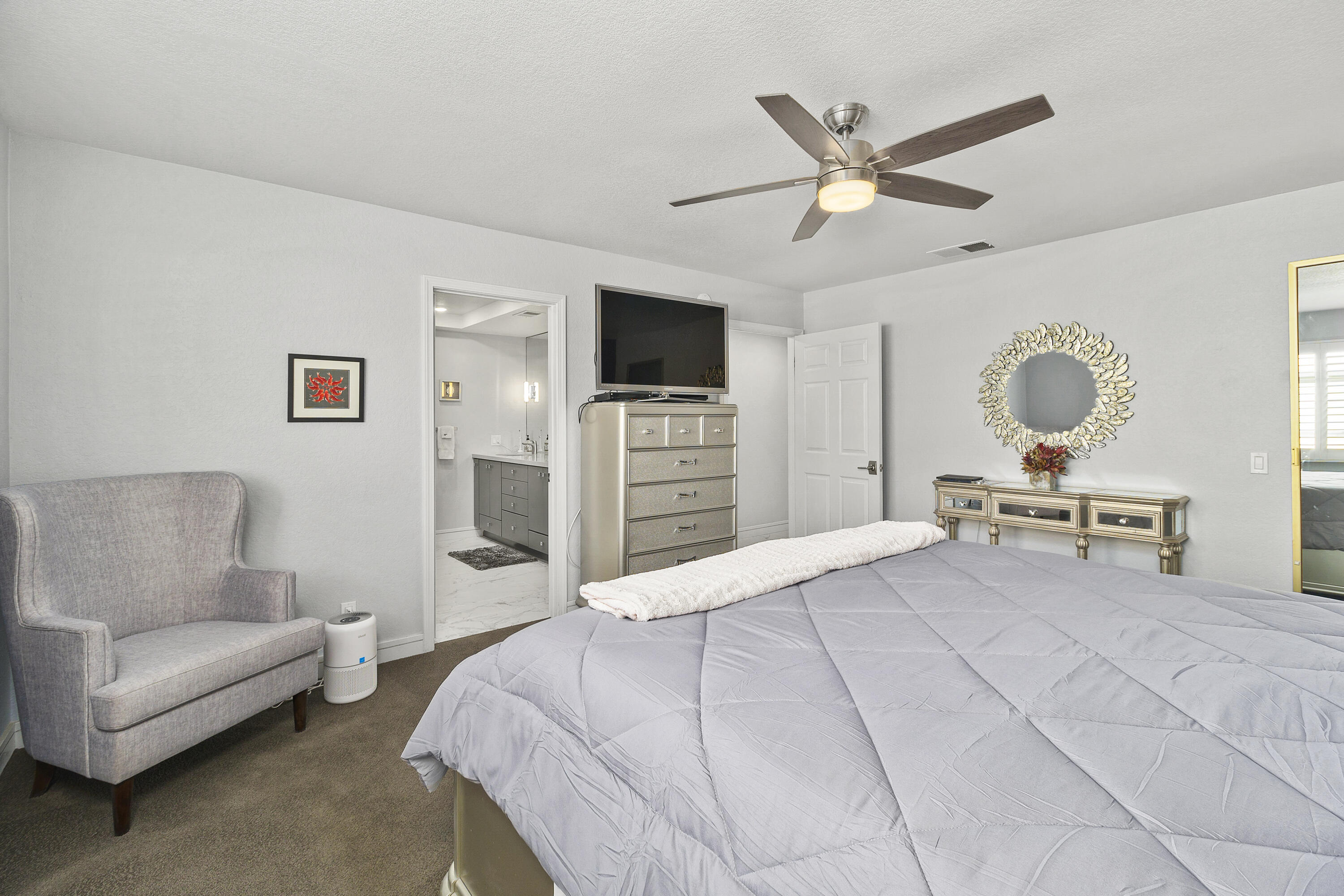 43 Conejo Circle Palm Desert, CA 92260 - Photo 24 of 58 a living room with furniture and a flat screen tv
