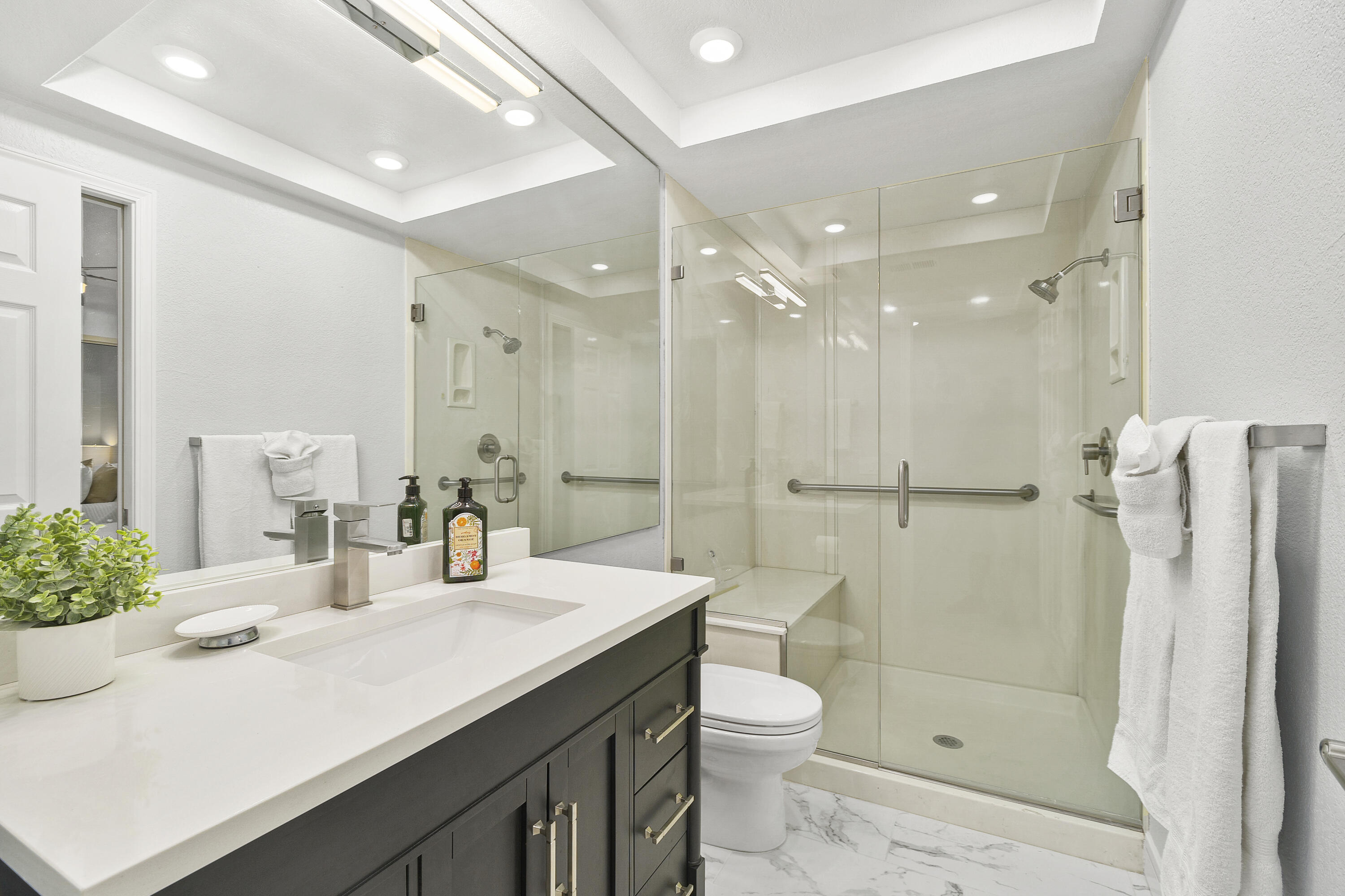 43 Conejo Circle Palm Desert, CA 92260 - Photo 25 of 58 a bathroom with a sink a toilet and shower