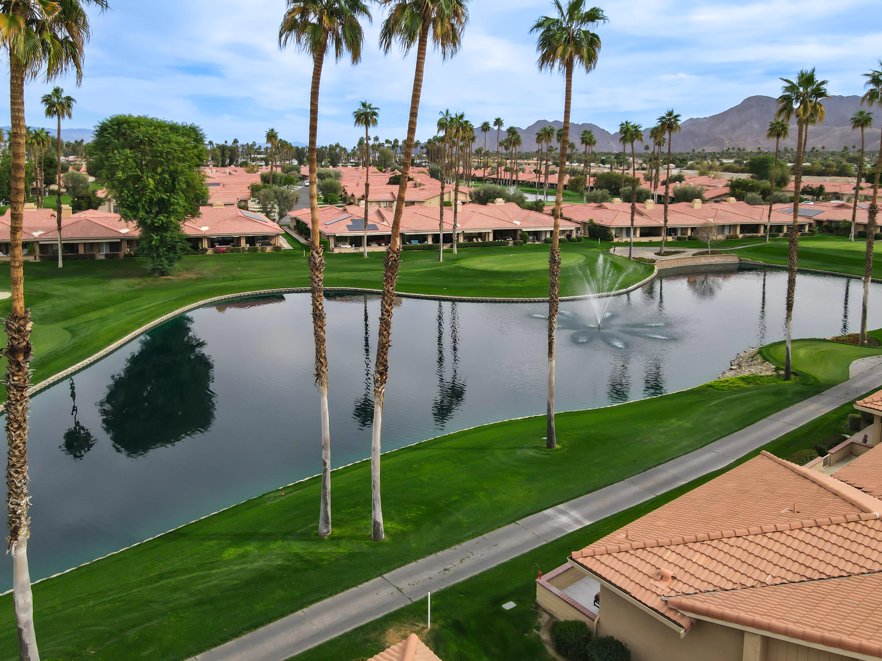 43 Conejo Circle Palm Desert, CA 92260 - Photo 41 of 58 a view of a lake with a big yard