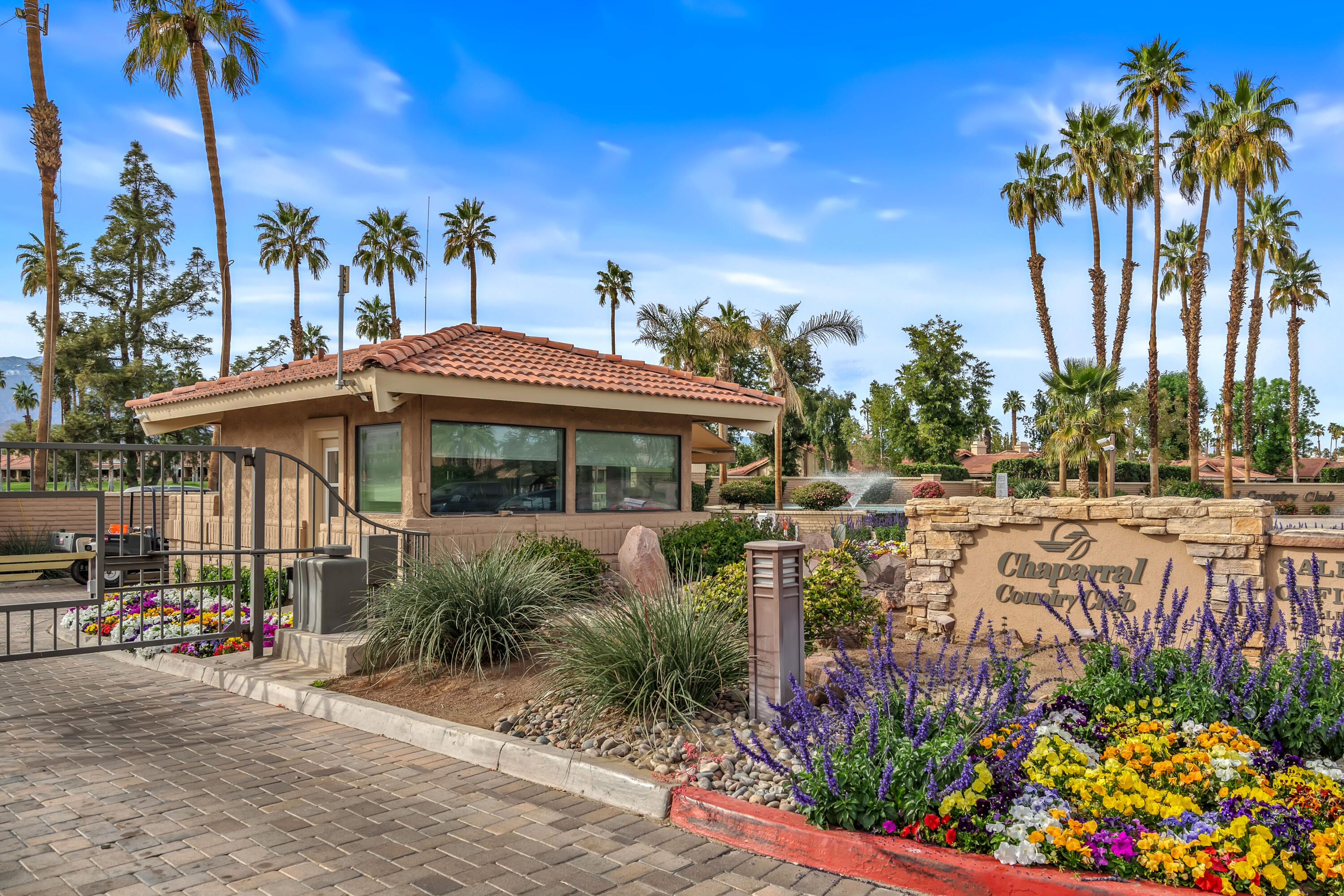 43 Conejo Circle Palm Desert, CA 92260 - Photo 43 of 58 a front view of a house with a yard and potted plants