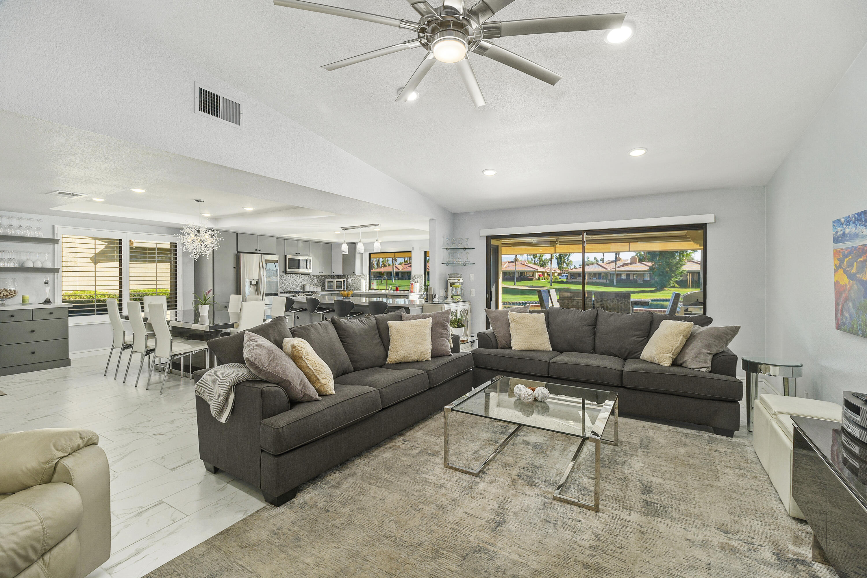 43 Conejo Circle Palm Desert, CA 92260 - Photo 8 of 58 a living room with furniture and a large window