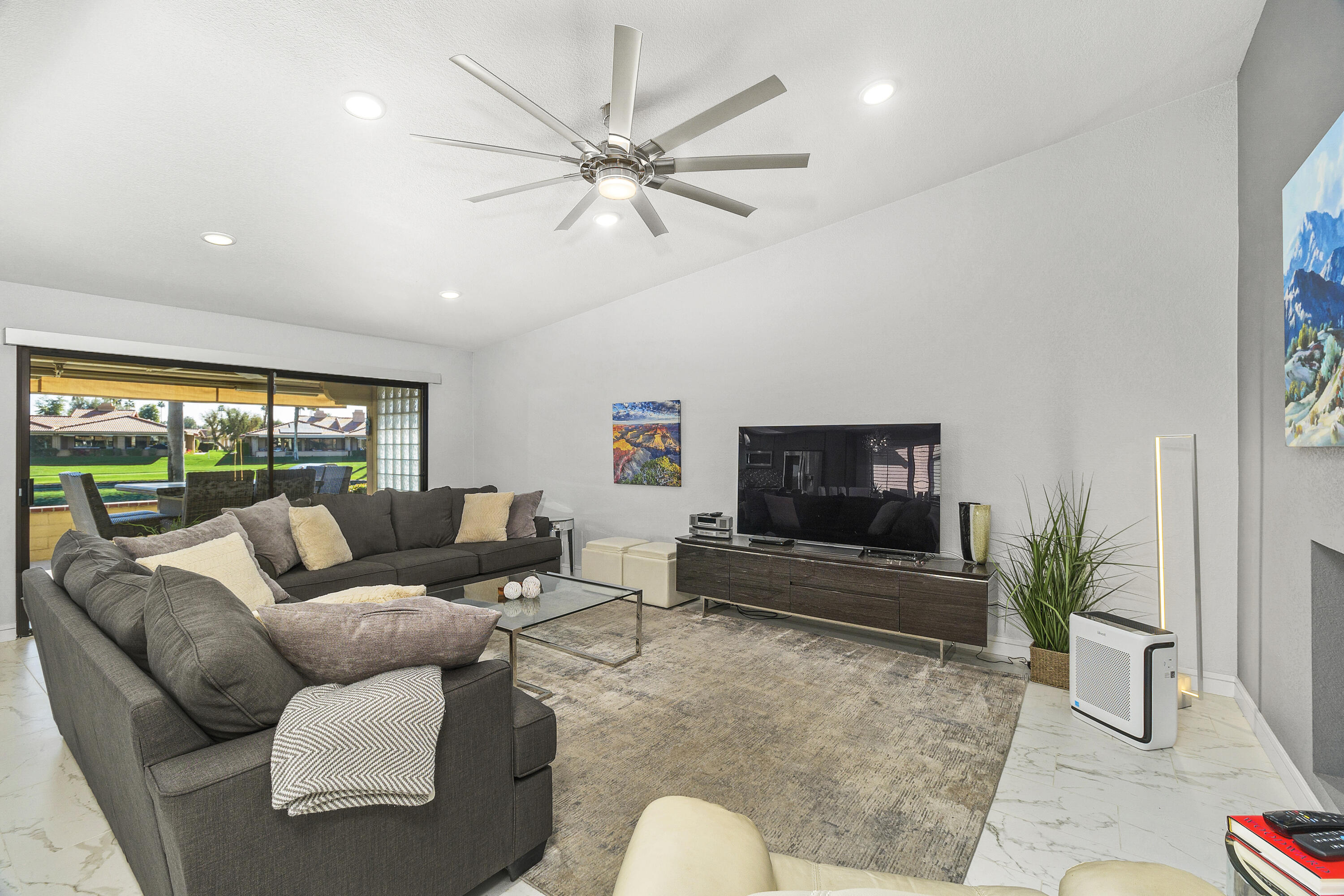 43 Conejo Circle Palm Desert, CA 92260 - Photo 10 of 58 a living room with furniture and a flat screen tv