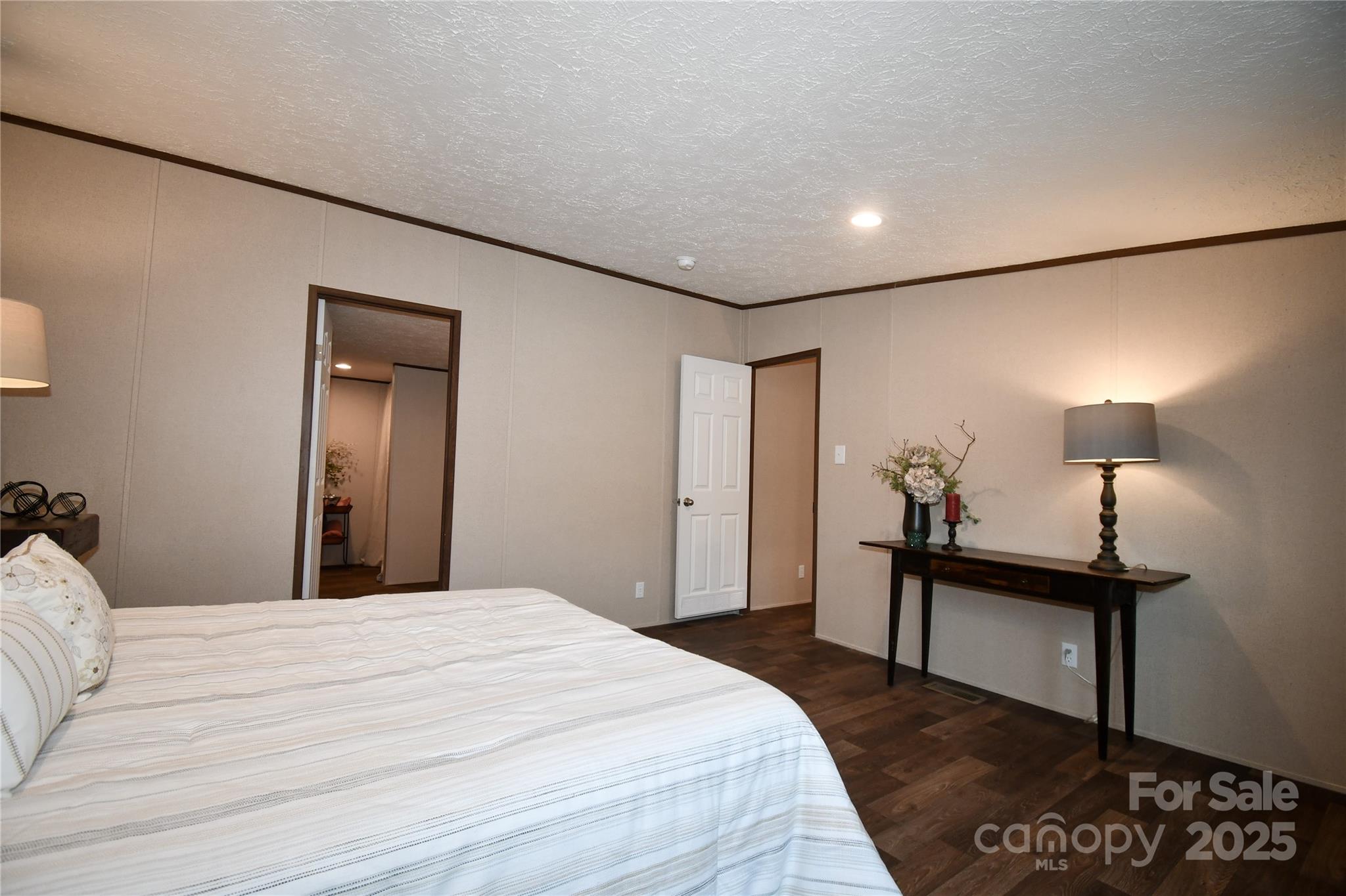 5339 Lockhart Road Kershaw, SC 29067 - Photo 12 of 28 a bedroom with a bed and a lamp on table