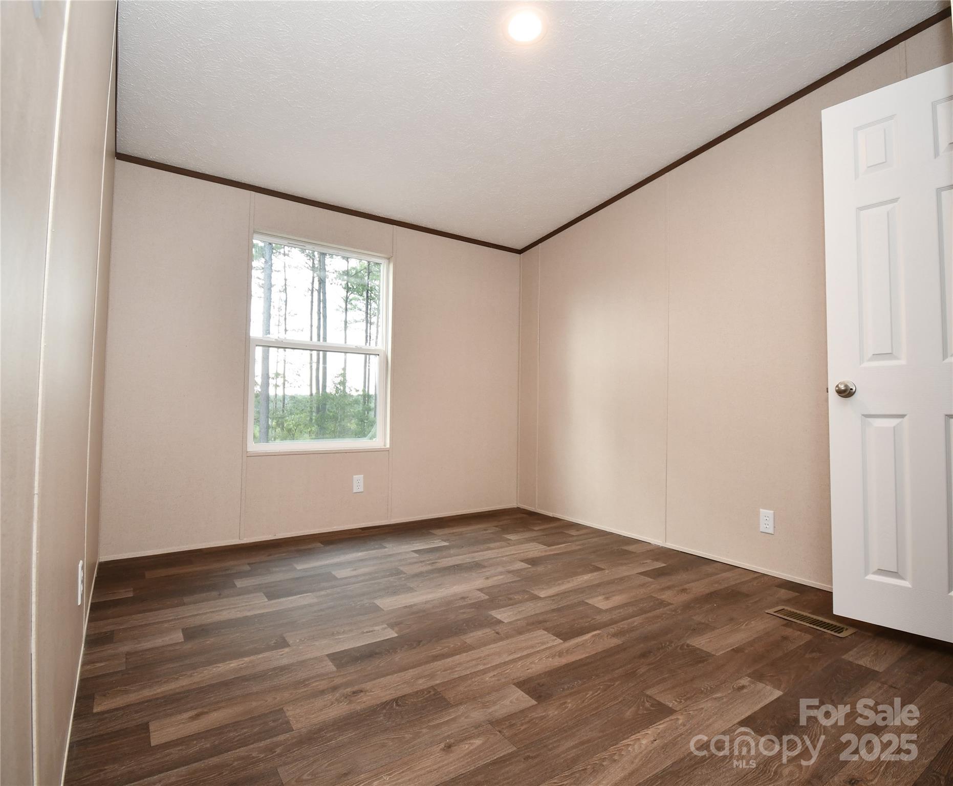 5339 Lockhart Road Kershaw, SC 29067 - Photo 20 of 28 an empty room with wooden floor and windows