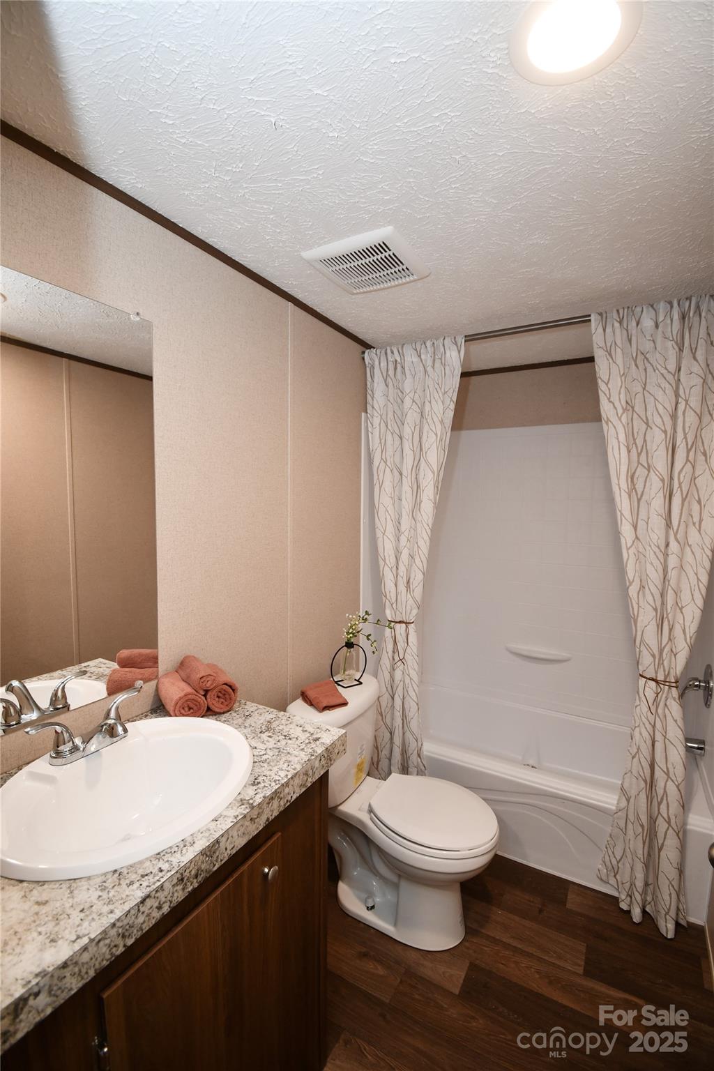 5339 Lockhart Road Kershaw, SC 29067 - Photo 22 of 28 a bathroom with a granite countertop sink toilet a mirror and shower