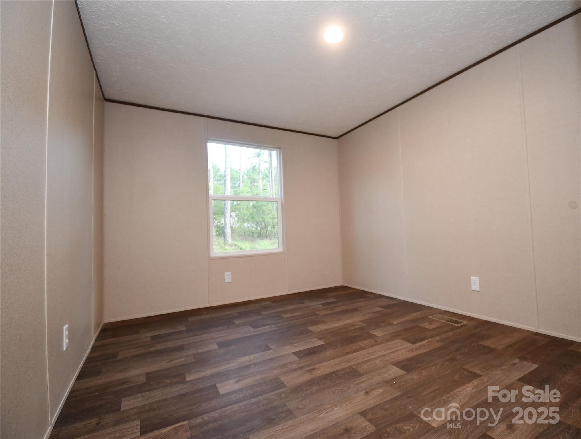5339 Lockhart Road Kershaw, SC 29067 - Photo 26 of 28 an empty room with wooden floor and windows