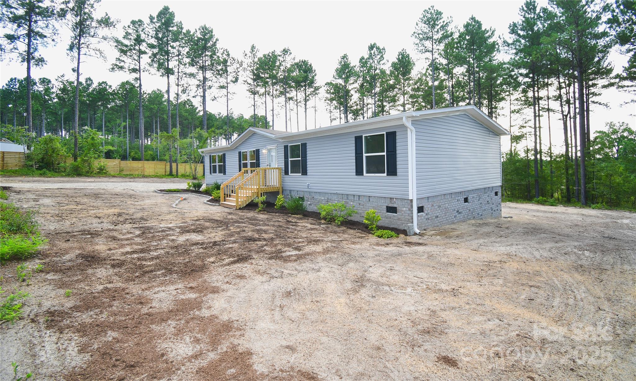5339 Lockhart Road Kershaw, SC 29067 - Photo 4 of 28 a view of a house with a yard and large trees