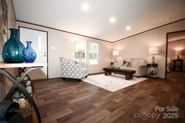 a living room with furniture and a mirror