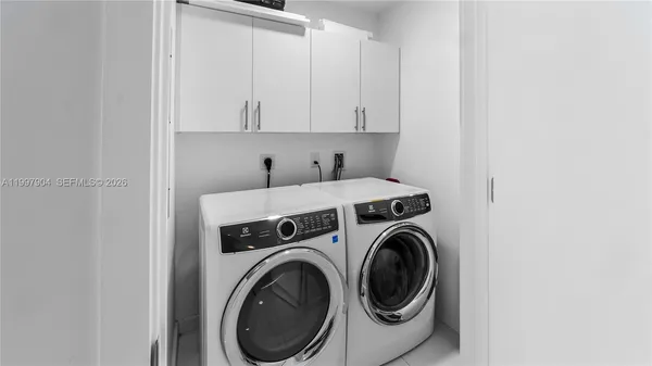 a utility room with dryer and washer