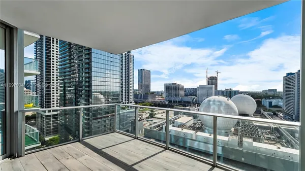 a view of balcony with furniture