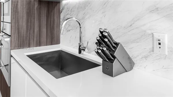 a kitchen with a stove and a sink