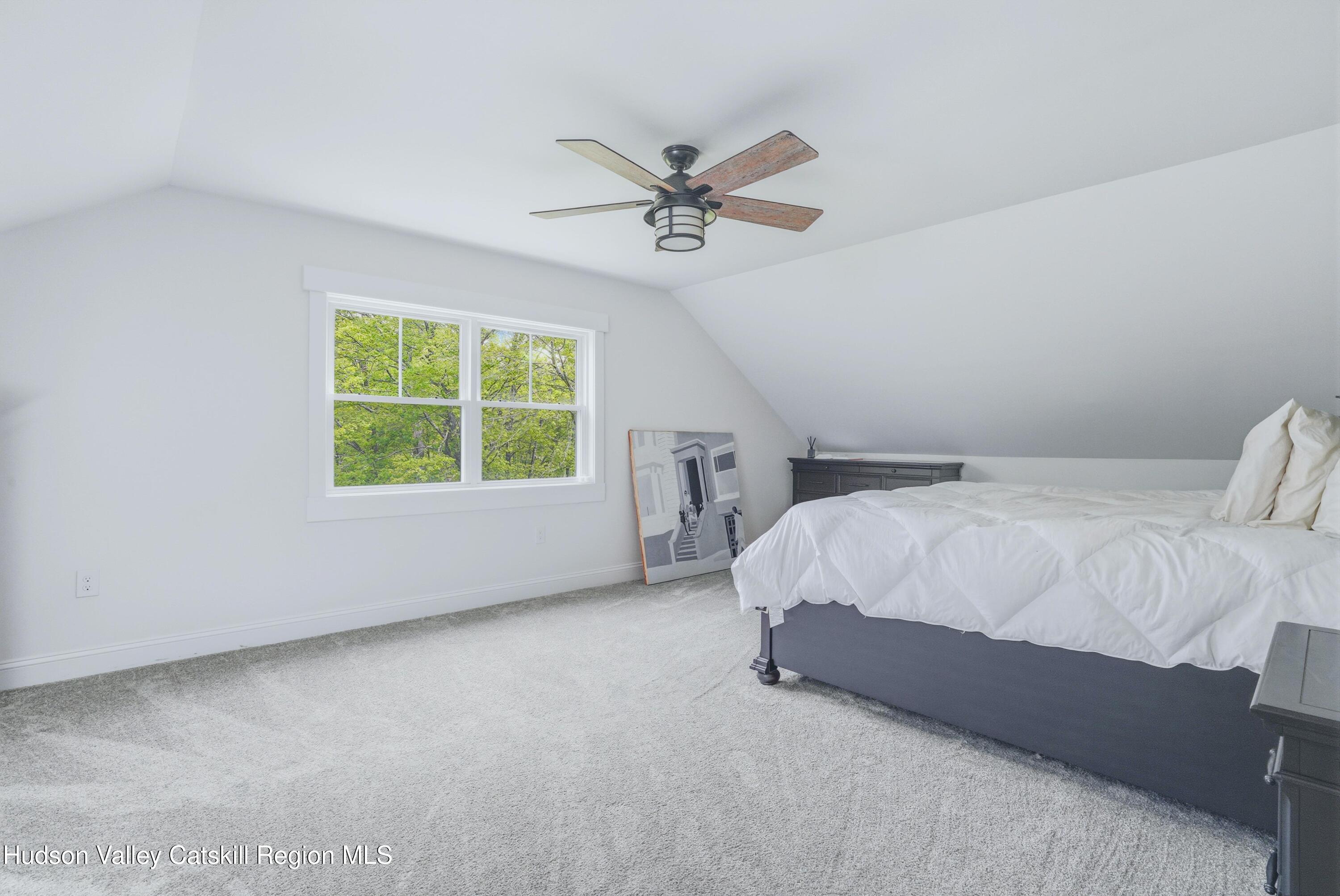 757 Taborton Road Sand Lake, NY 12153 - Photo 21 of 32 a bed sitting in a bedroom next to a window