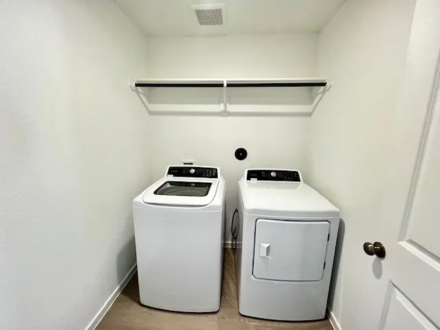 a utility room with dryer and washer