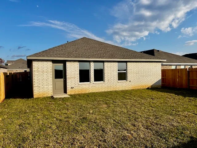 a house with yard in front of it