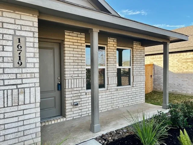 a front view of a house with a glass door