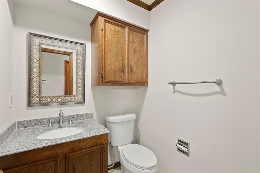 10135 Rita Road Dallas, TX 75243 - Photo 12 of 24 Bathroom featuring vanity and ornamental molding