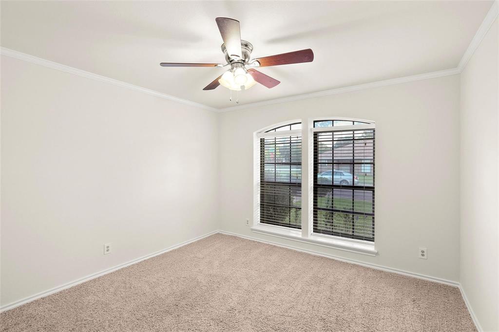 10135 Rita Road Dallas, TX 75243 - Photo 13 of 24 Spare room with crown molding, carpet floors, and ceiling fan