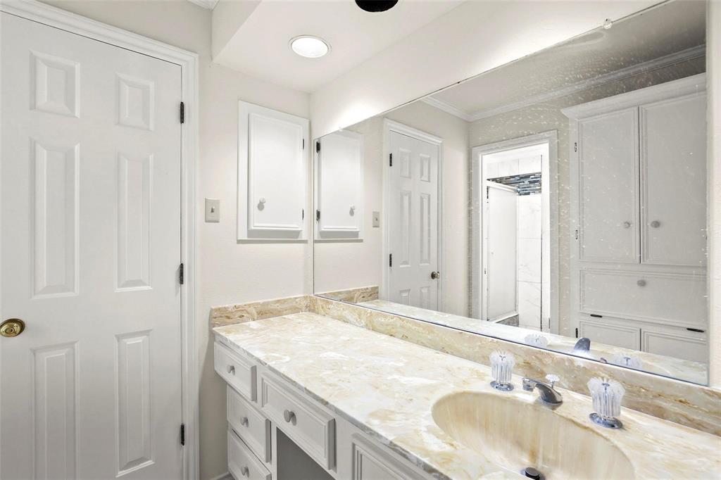 10135 Rita Road Dallas, TX 75243 - Photo 21 of 24 Bathroom with vanity and crown molding