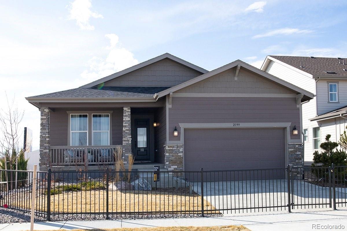 2199 Barela Drive Berthoud, CO 80513 - Photo 1 of 32 a front view of a house with a glass door and a floor to ceiling window