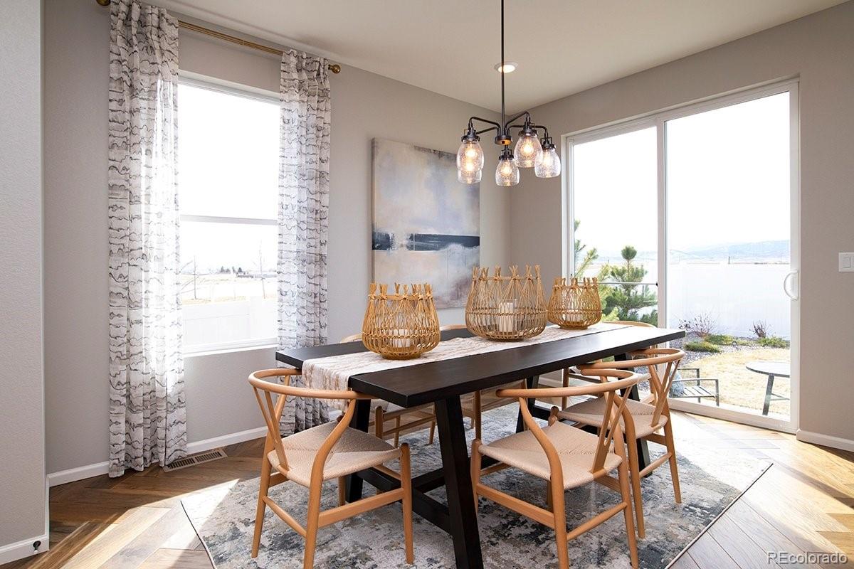 2199 Barela Drive Berthoud, CO 80513 - Photo 11 of 32 a view of a dining room with furniture window and outside view