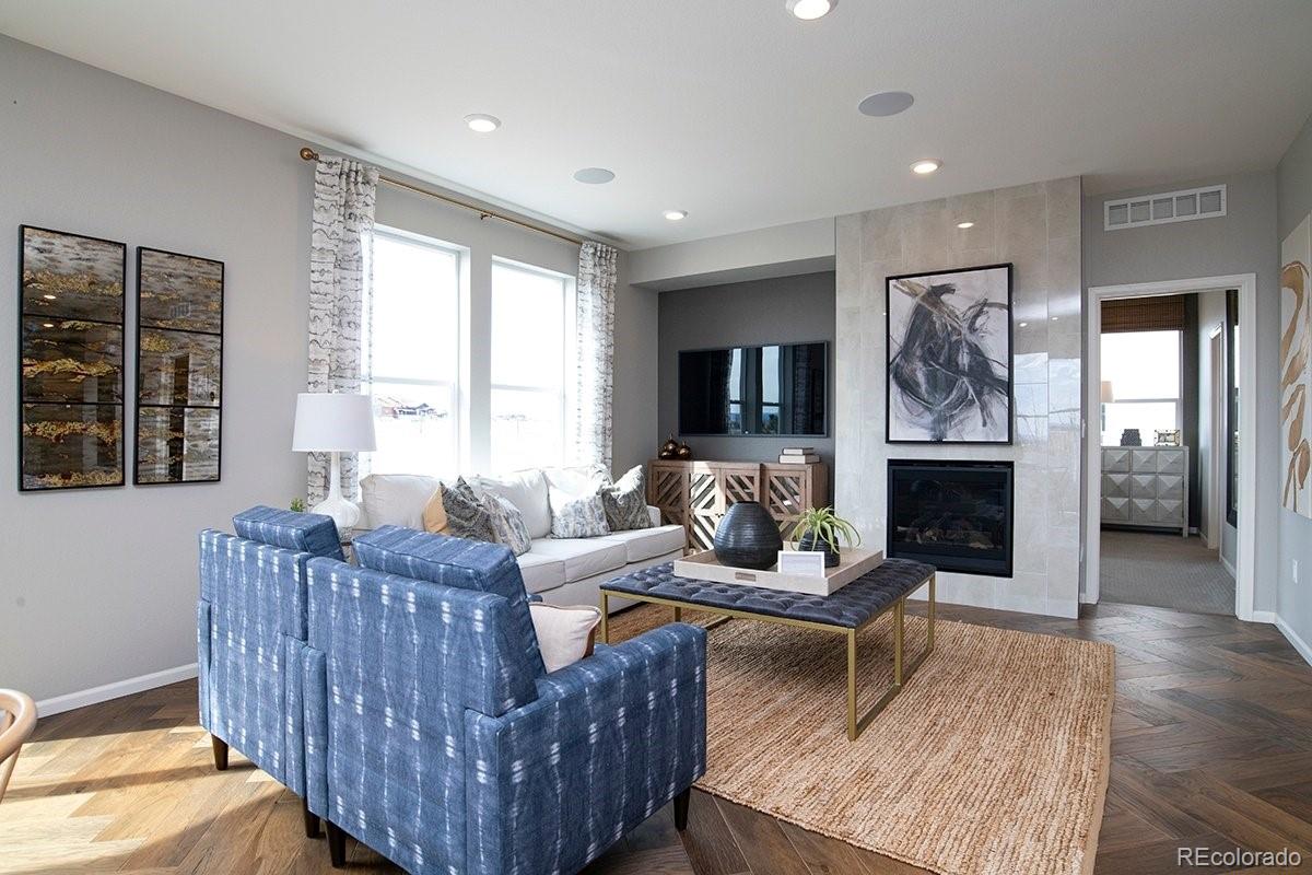 2199 Barela Drive Berthoud, CO 80513 - Photo 13 of 32 a living room with furniture and a fireplace