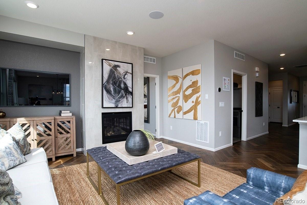 2199 Barela Drive Berthoud, CO 80513 - Photo 14 of 32 a living room with furniture and a flat screen tv
