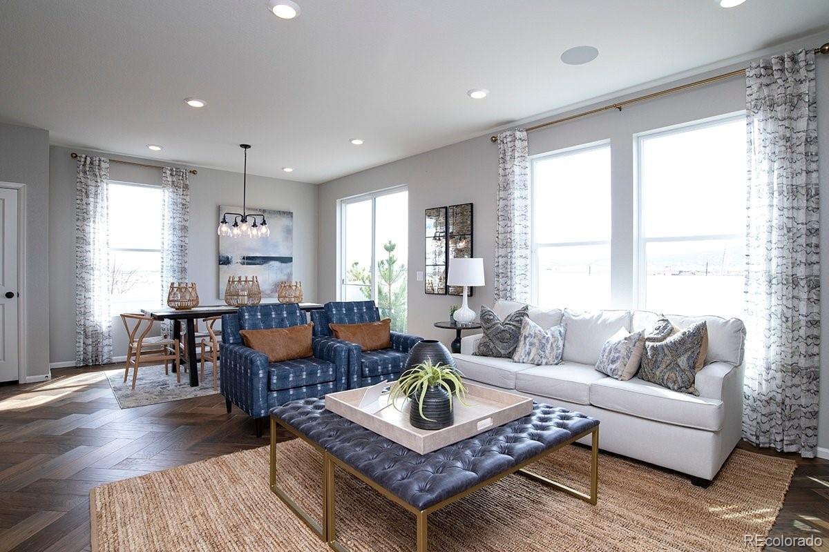 2199 Barela Drive Berthoud, CO 80513 - Photo 15 of 32 a living room with furniture and a large window