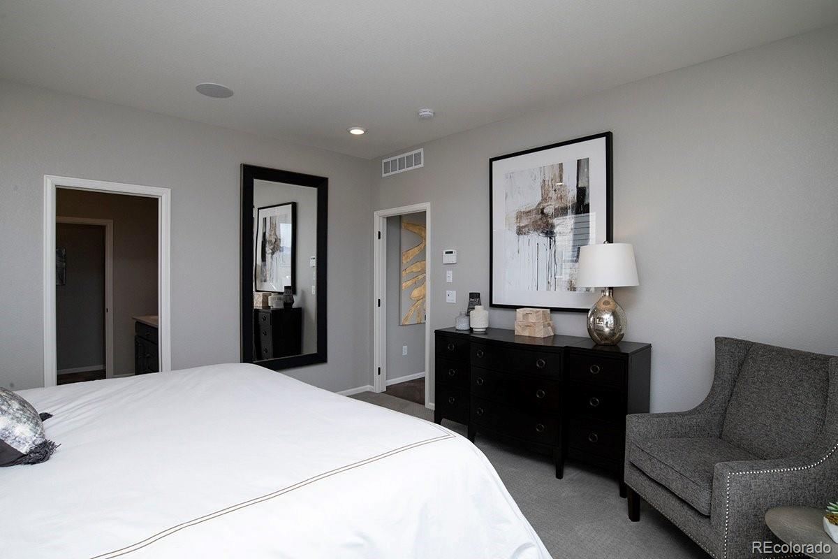 2199 Barela Drive Berthoud, CO 80513 - Photo 18 of 32 a bedroom with a bed and a couch