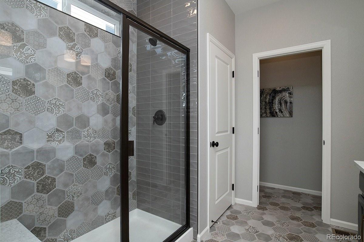 2199 Barela Drive Berthoud, CO 80513 - Photo 19 of 32 a bathroom with a shower and a sink