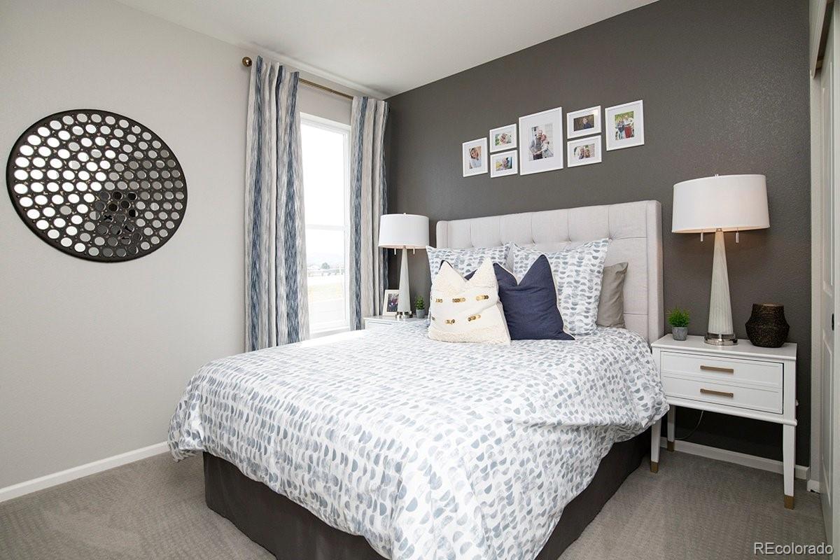 2199 Barela Drive Berthoud, CO 80513 - Photo 21 of 32 a bedroom with a bed and a window