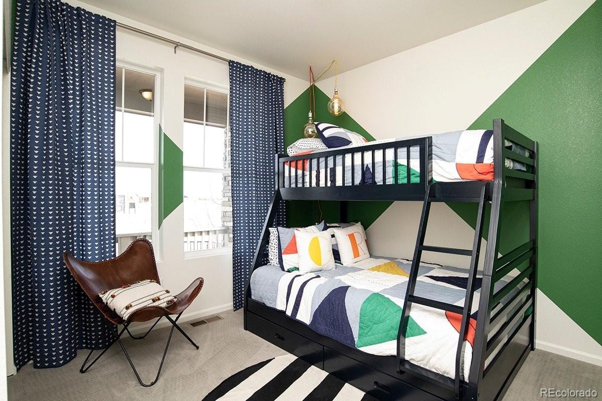 2199 Barela Drive Berthoud, CO 80513 - Photo 23 of 32 a bedroom with a bed and a window