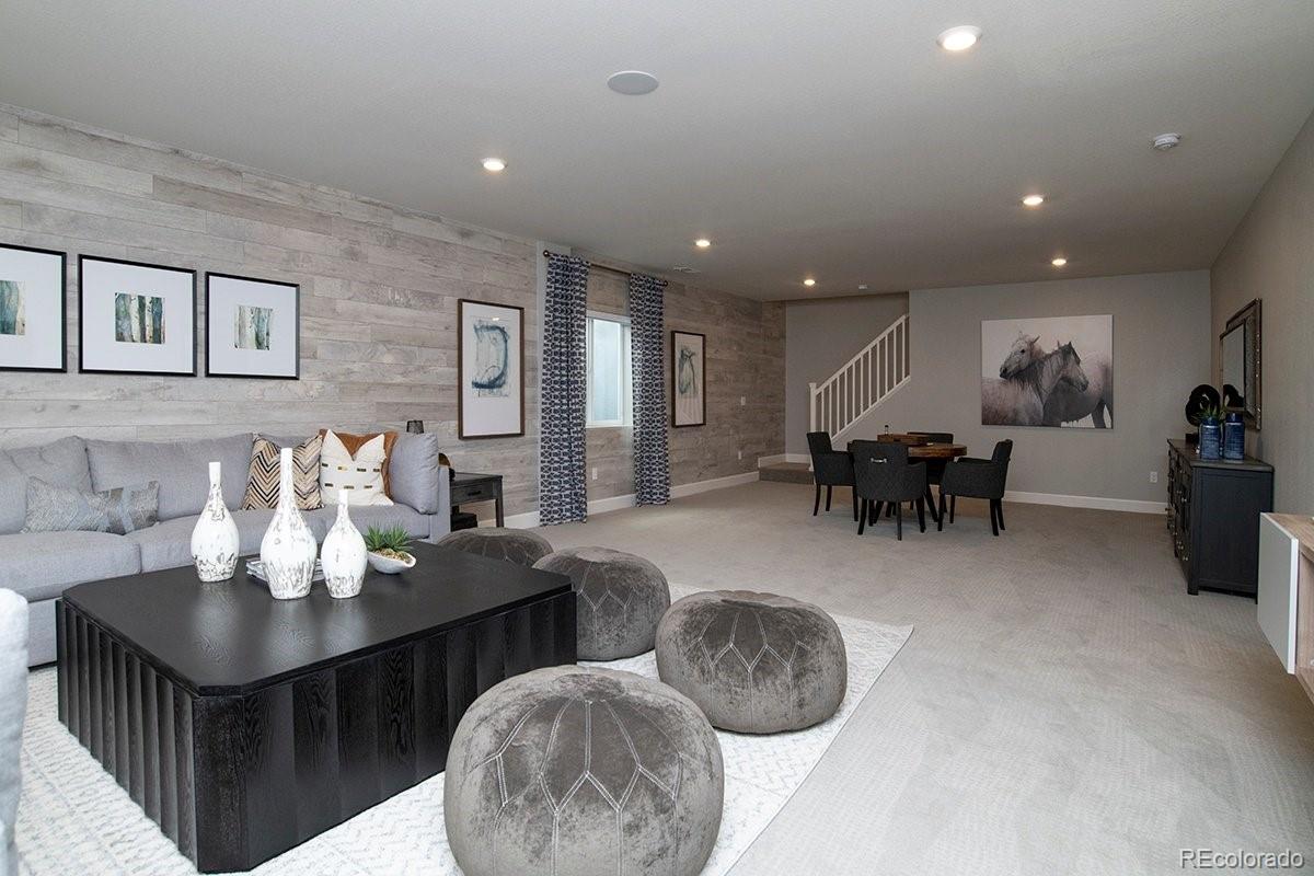 2199 Barela Drive Berthoud, CO 80513 - Photo 28 of 32 a living room with furniture and a dining table