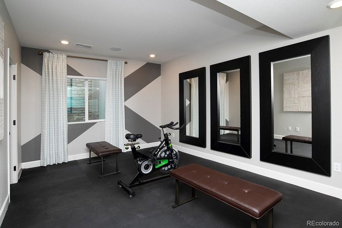 2199 Barela Drive Berthoud, CO 80513 - Photo 29 of 32 a living room with furniture pool table and a large window