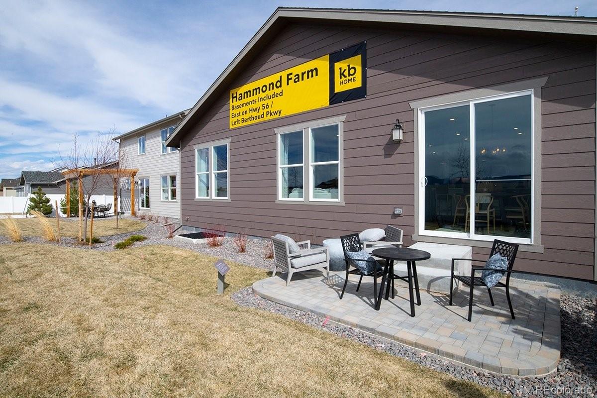 2199 Barela Drive Berthoud, CO 80513 - Photo 32 of 32 a view of a dinning table and chairs in patio