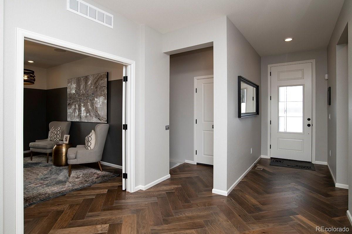 2199 Barela Drive Berthoud, CO 80513 - Photo 4 of 32 a view of livingroom with furniture and wooden floor