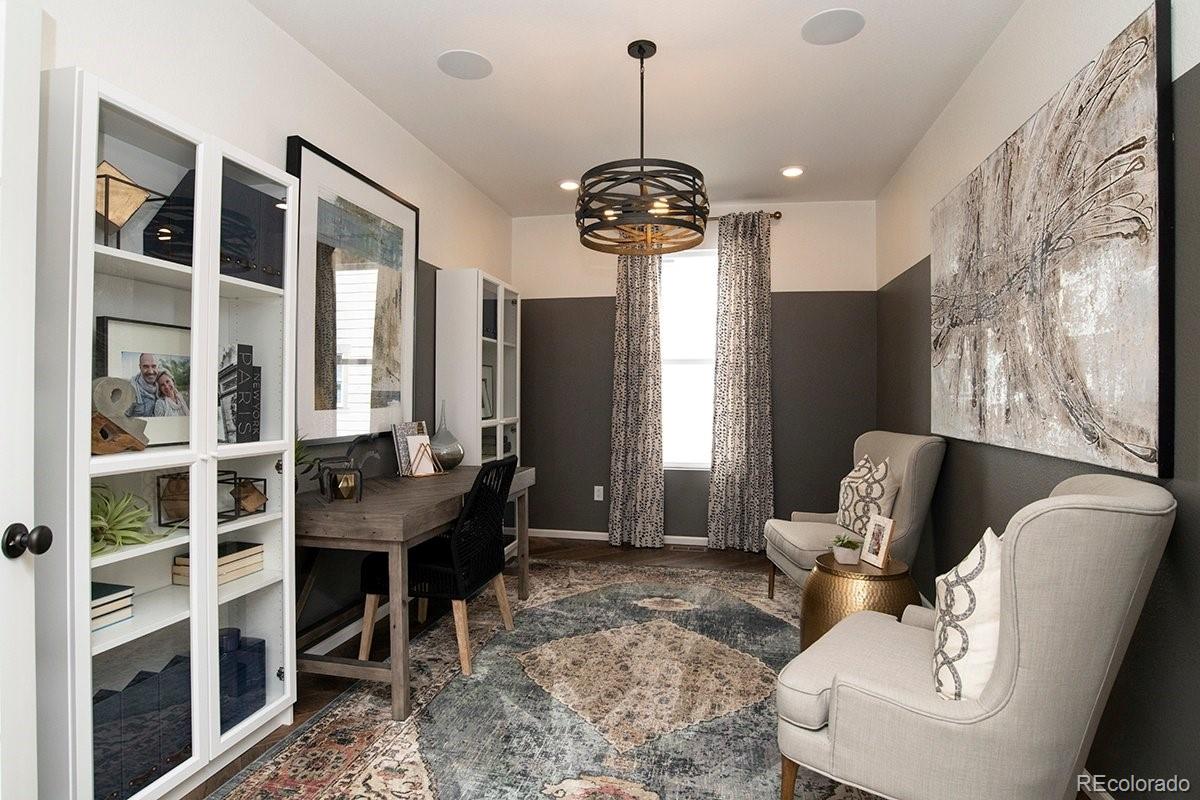 2199 Barela Drive Berthoud, CO 80513 - Photo 6 of 32 a view of a livingroom with furniture window and wooden floor