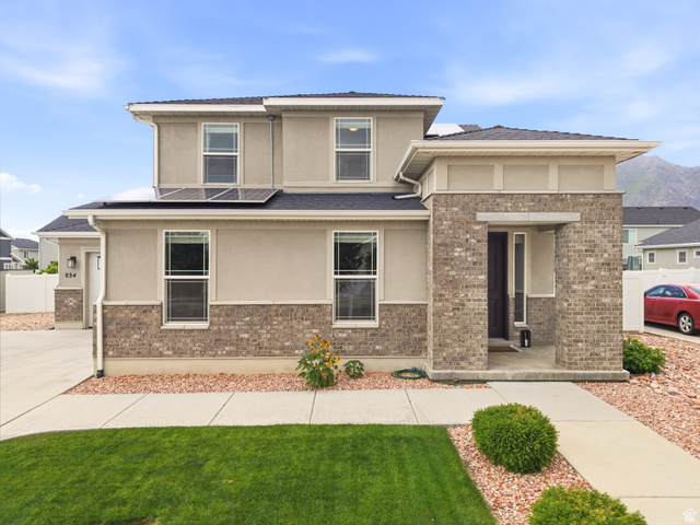 834 West 1050th Street South Springville, UT 84663 - Photo 1 of 26 Two-story residence featuring a brick and stucco facade with a covered entry