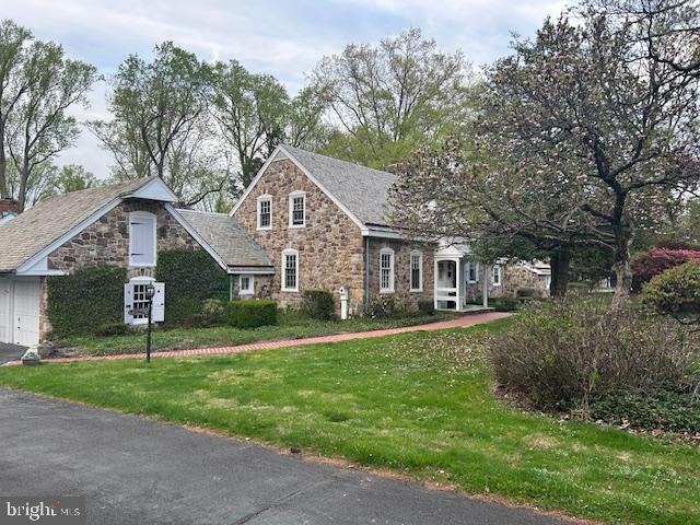 1521 Old Welsh Road Huntingdon Valley, PA 19006 - Photo 1 of 38 a front view of a house with a yard