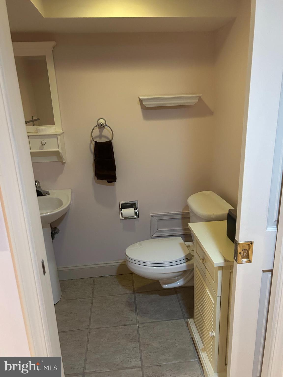 1521 Old Welsh Road Huntingdon Valley, PA 19006 - Photo 11 of 38 a white toilet sitting next to a sink and vanity