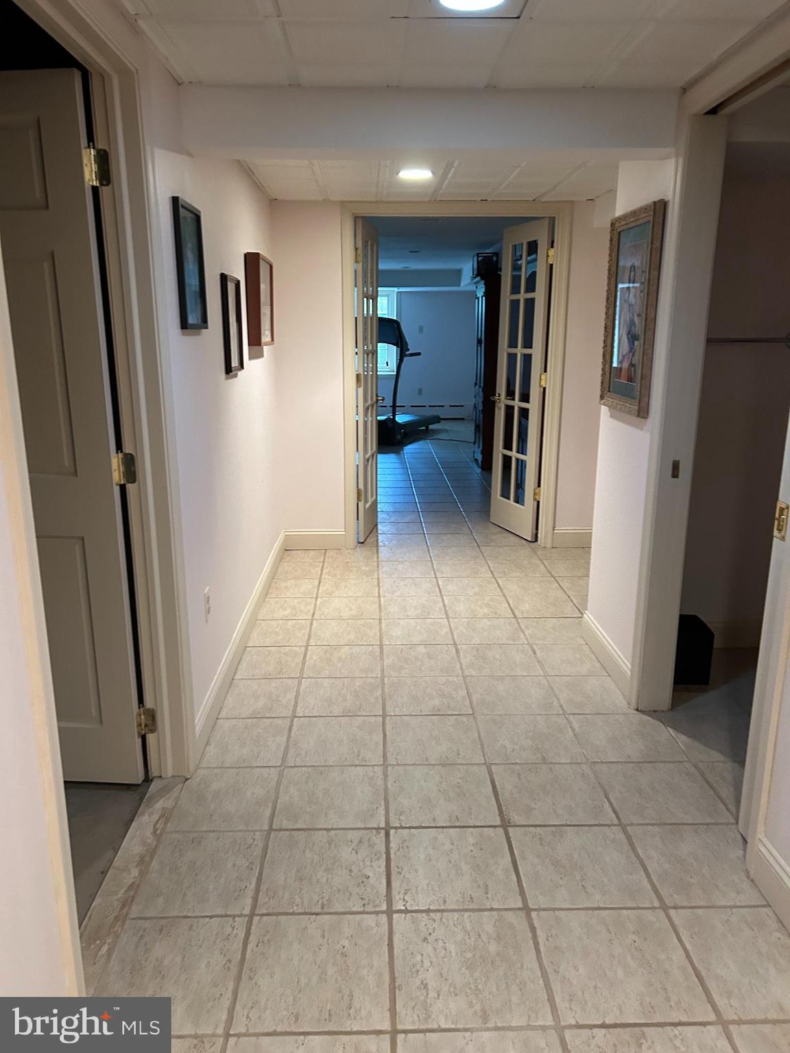 1521 Old Welsh Road Huntingdon Valley, PA 19006 - Photo 12 of 38 a view of hallway with a window and a refrigerator