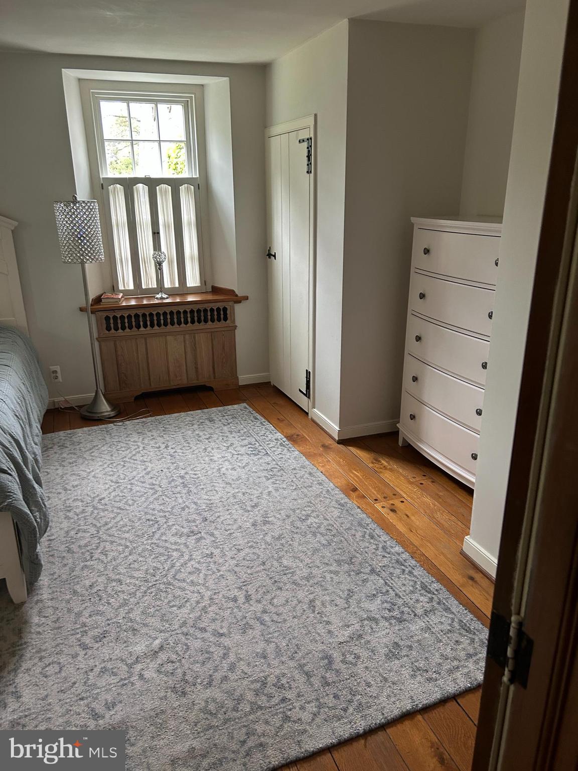 1521 Old Welsh Road Huntingdon Valley, PA 19006 - Photo 17 of 38 wooden floor in an empty room with a window