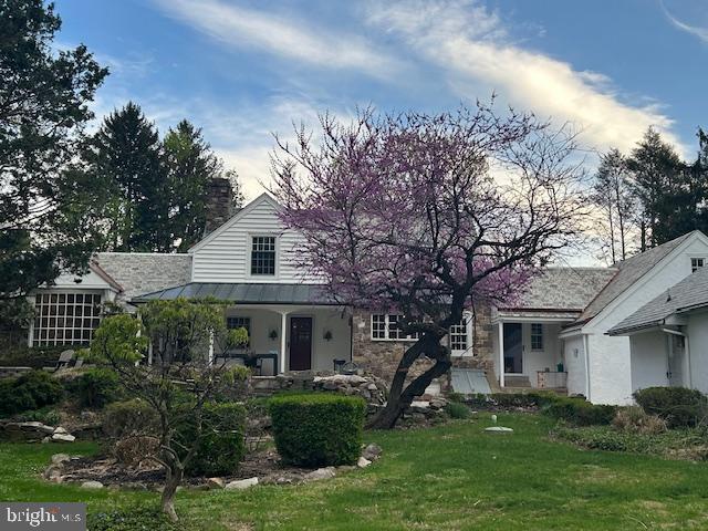 1521 Old Welsh Road Huntingdon Valley, PA 19006 - Photo 2 of 38 a front view of a house with a garden