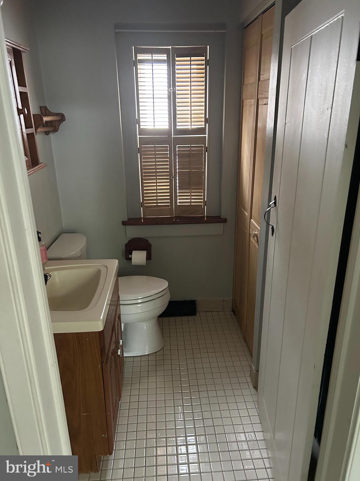 1521 Old Welsh Road Huntingdon Valley, PA 19006 - Photo 21 of 38 a bathroom with a sink a toilet a window and shower