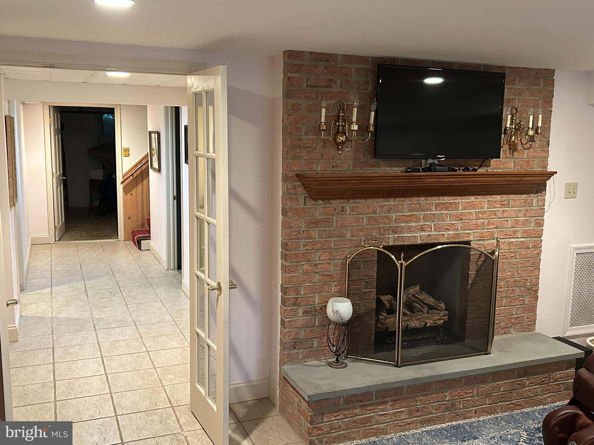 1521 Old Welsh Road Huntingdon Valley, PA 19006 - Photo 7 of 38 a living room with furniture and a fireplace
