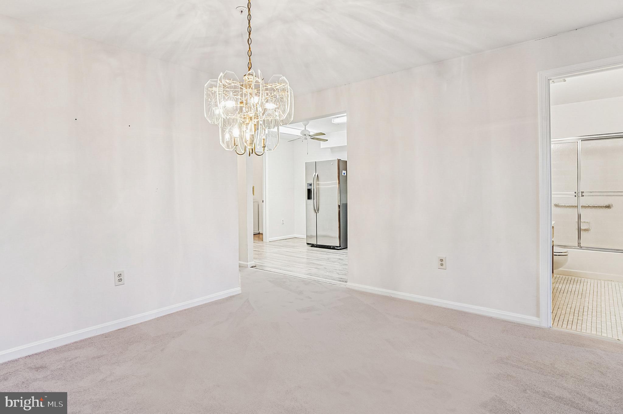 2900 Shipmaster Way, Unit 216 Annapolis, MD 21401 - Photo 19 of 53 Dining Area with Sparking Chandelier