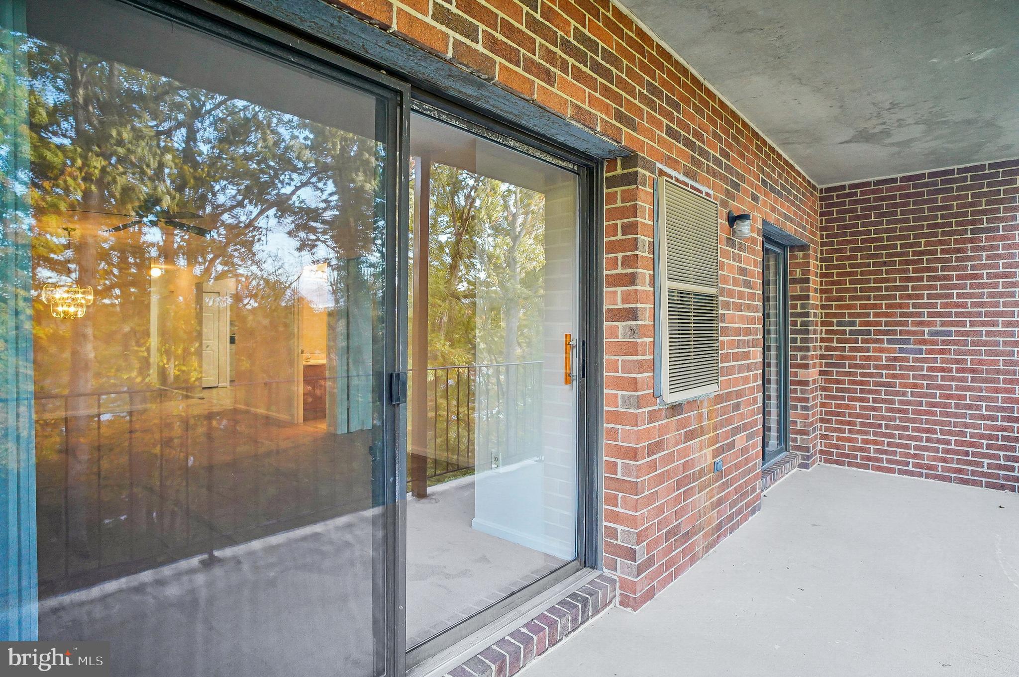 2900 Shipmaster Way, Unit 216 Annapolis, MD 21401 - Photo 23 of 53 Sliders Spilling Out to Dining/Relaxation Balcony