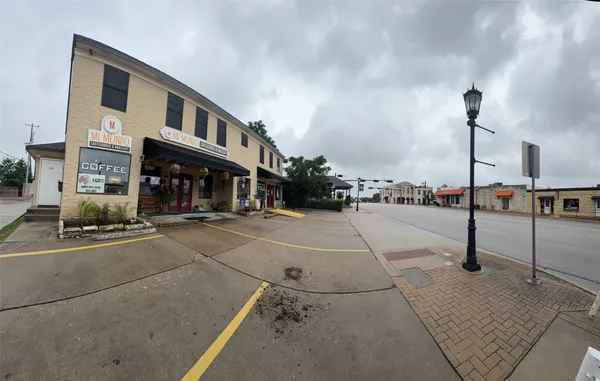 a view of a street with cars