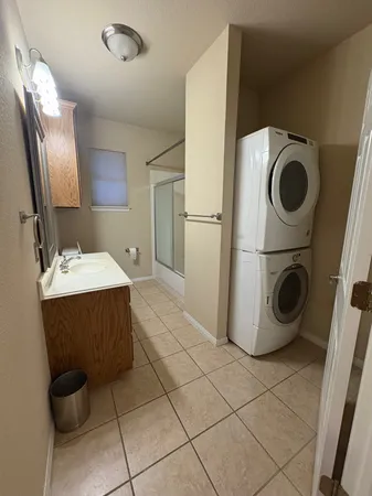 a bathroom with a sink and mirror
